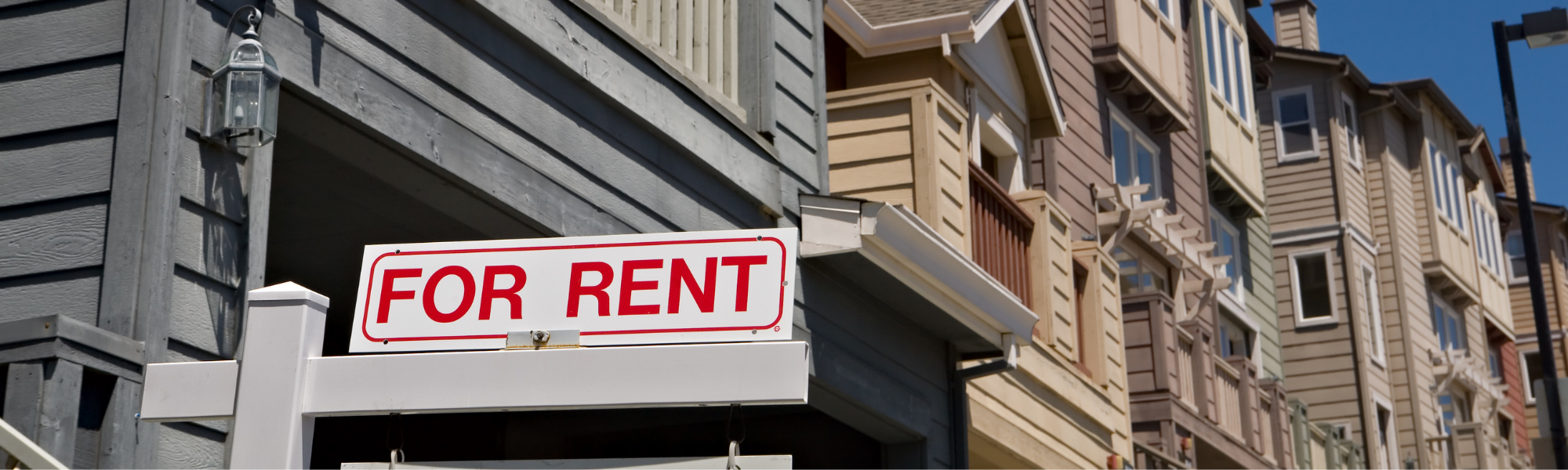 For rent sign outside row houses